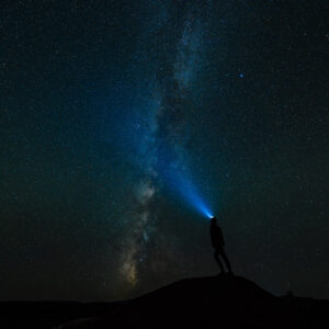 Looking up at the Milky Way with headlamp on during nighttime in Capitol Reef National Park in Utah