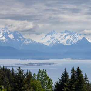 Far view of the Homer Spit with mountain range in the background