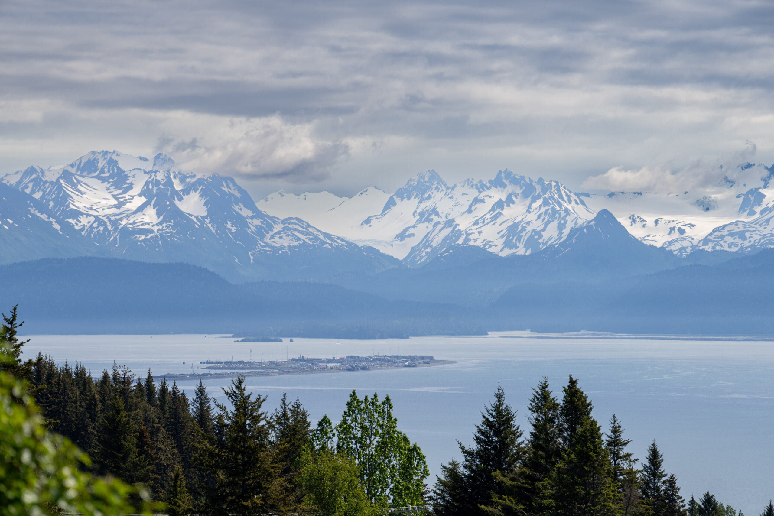 Far view of the Homer Spit with mountain range in the background