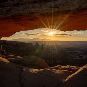 Sunrise shining through Mesa Arch in Canyonlands National Park located in Southern Utah