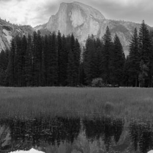 Half Dome in Yosemite National Park in Black and White with mirror image in still lake